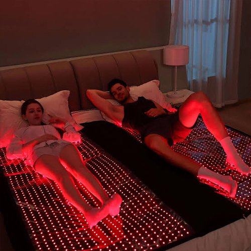 RICOVSUN red light therapy sleeping bag in a home relaxation setting